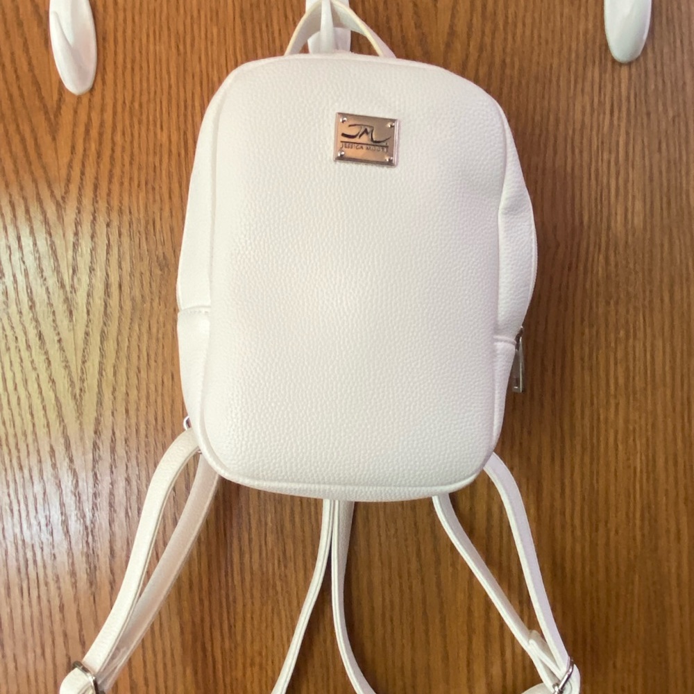 Super cute mini white faux leather backpack.